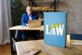 LABOR LAW book`s title. CollectiveÃÂ labour lawÃÂ relates to the tripartite relationship between employee, employer and union Royalty Free Stock Photo